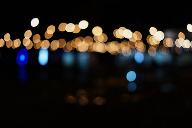 istock Colorful Bokeh in the darkness, light from night market 1163395146
