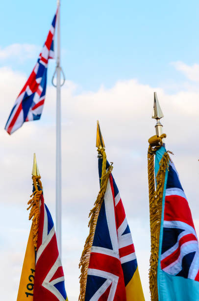 istock British war memorial flags and standards in front of a Union Flag 1163404854