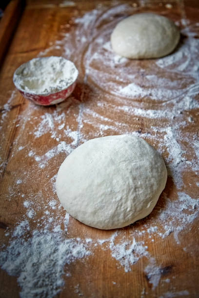 istock Raw dough on the table at home 1163413922