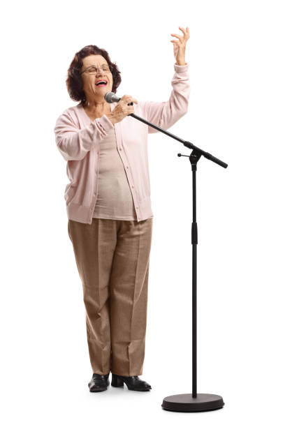 istock Elderly female singing on a microphone 1163415171