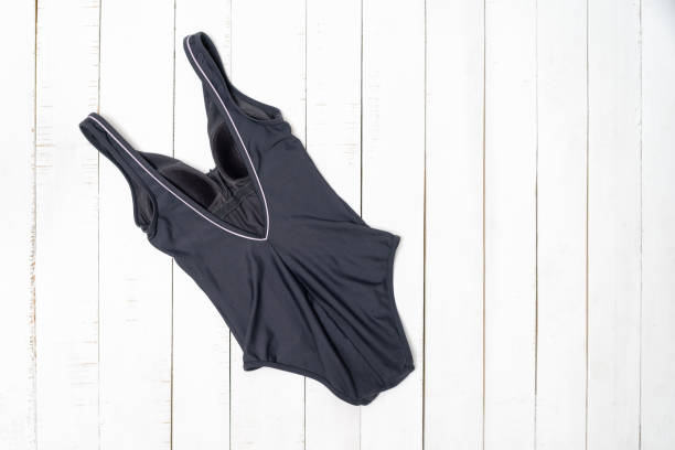 istock Gray swimsuit on a white background, back view. Fashion concept 1163415874