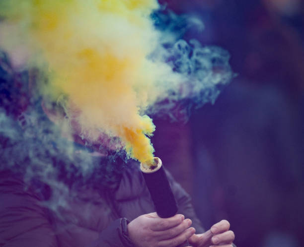 istock Colorful yellow smoke bomb 1163416234