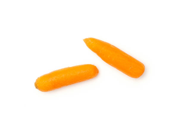 istock Peeled baby carrot isolated on white 1163417318