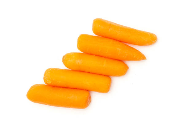 istock Peeled baby carrot isolated on white 1163417324