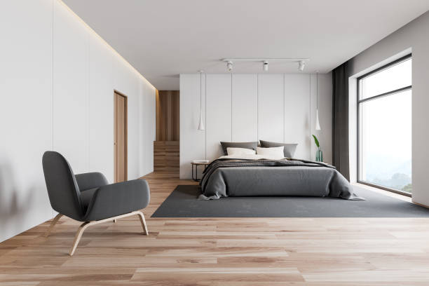 istock White master bedroom interior with armchair 1163417925