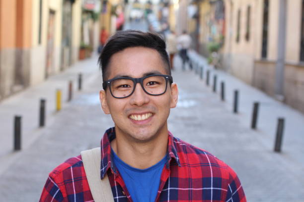 istock Asian university student outdoors portrait 1163424217