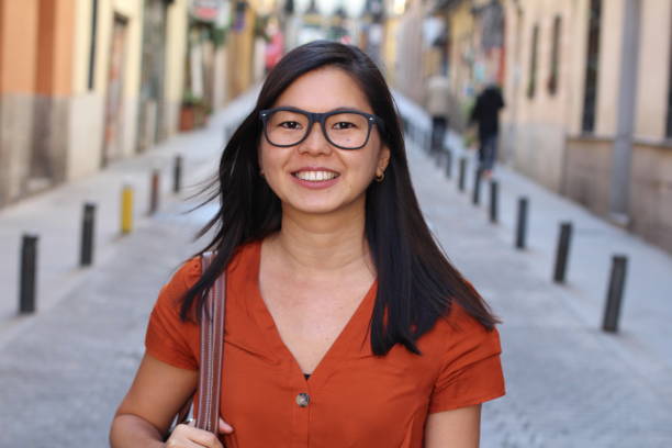 istock Charming Asian woman outdoors close up 1163424224