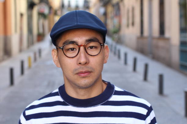istock Cute Asian man looking at camera 1163424261