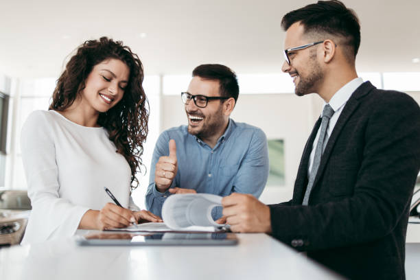 istock Attractive couple buying new car 1163424462