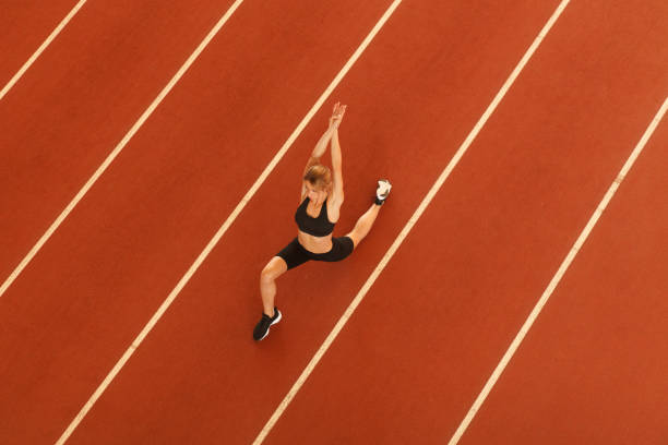 istock young blonde beautiful sportswoman training on athletic stadium 1163426933