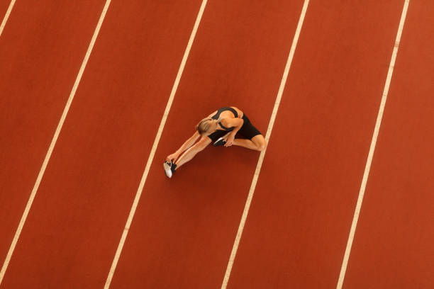 istock young blonde beautiful sportswoman training on athletic stadium 1163426940
