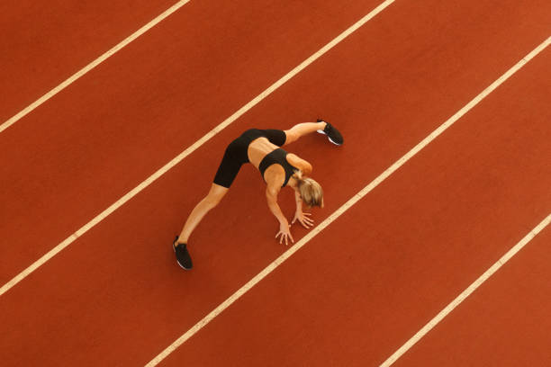istock young blonde beautiful sportswoman training on athletic stadium 1163426945