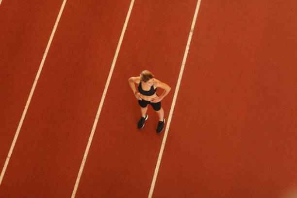 istock young blonde beautiful sportswoman training on athletic stadium 1163426964