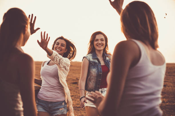 istock Girlfriends meeting to go on adventurous road trip together 1163428620