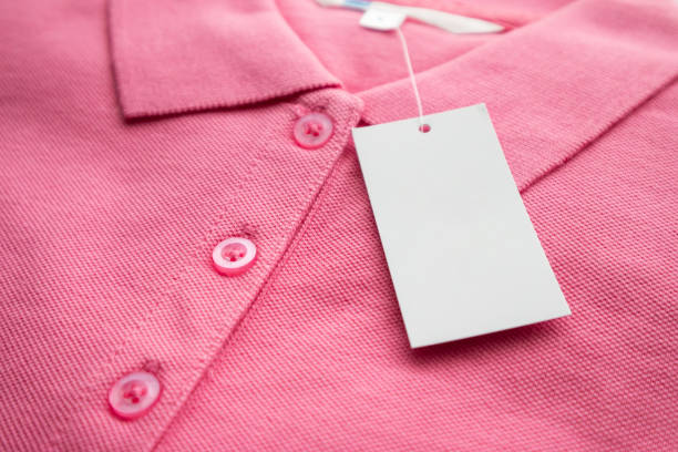 istock Blank white clothes tag label on new shirt 1163428641