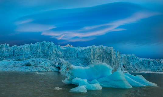 A massive lenticular cloud adds drama to the already dramatic Perito Moreno Glacier in Argentina's Los Glaciares National Park