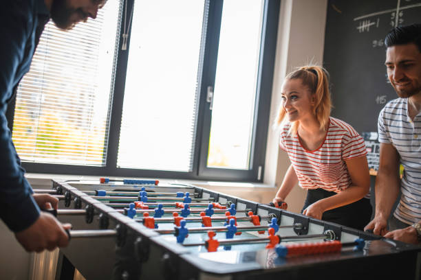 istock Coworkers Taking a Break to Play Foosball 1163429426