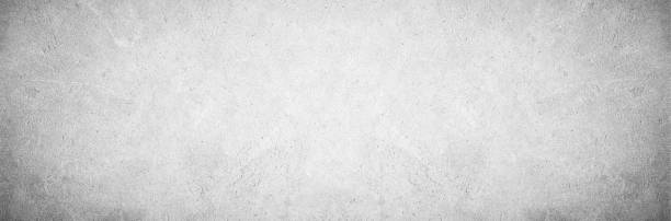 istock Panoramic grey paint limestone texture background in white light seam home wall paper. Back flat subway concrete stone table floor concept surreal granite quarry stucco surface panorama grunge pattern. 1163429624