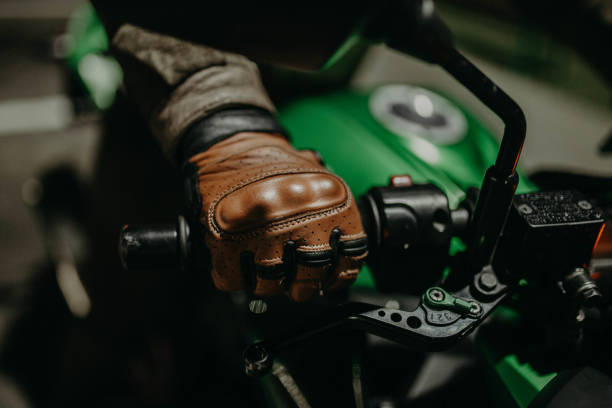 istock Brown leather biker gloves for motorcyclist, outfit. 1163432661