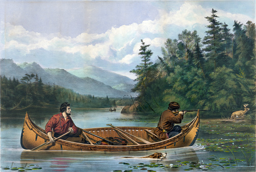 Vintage illustration features two men in a canoe, one man taking aim with a rifle at a deer on shore.