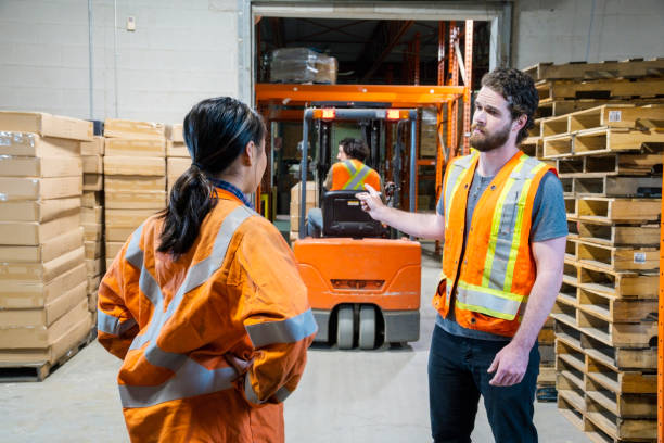 istock An industrial warehouse workplace safety topic. A manager discusses an issue about a forklift driver. 1163442189