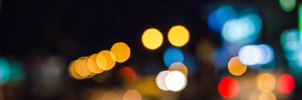 istock abstract blurred of blue and silver glittering shine bulbs lights background 1163454801
