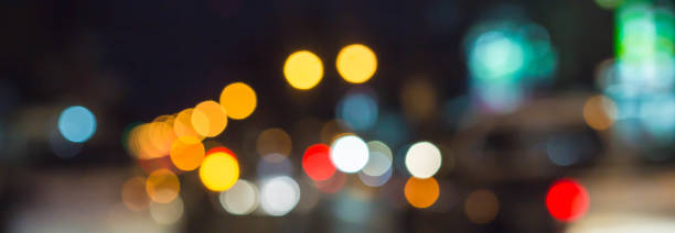 istock abstract blurred of blue and silver glittering shine bulbs lights background 1163454806