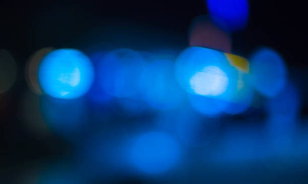 istock abstract blurred of blue and silver glittering shine bulbs lights background 1163454848