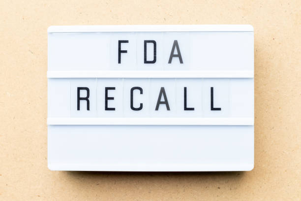 White lightbox with word fda recall on wood background White lightbox with word fda recall on wood background food and drug administration photos stock pictures, royalty-free photos & images