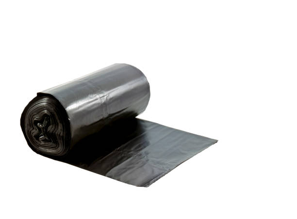 istock roll of disposable trash bags isolated on white background. This had clipping path. 1163456038