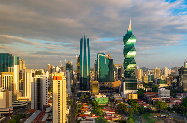 Panama City at Sunrise, Central America The modern urban skyline of Panama City with futuristic skyscrapers at sunrise, Panama, Central America. panama city panama photos stock pictures, royalty-free photos & images