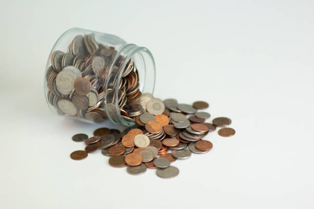 istock Coins out of a jar 1163458871