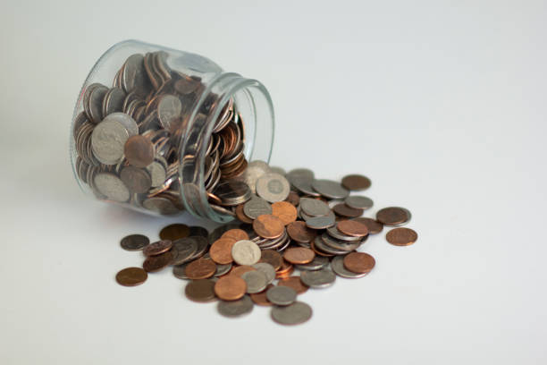 istock Coins out of a jar 1163458936