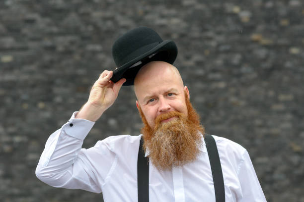 istock Polite bald bearded man doffing his hat 1163460635