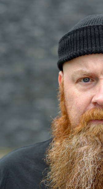 istock Half face portrait of a serious intense man 1163461493