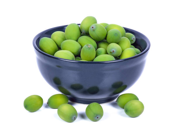 istock Lotus seeds green on white background 1163464848