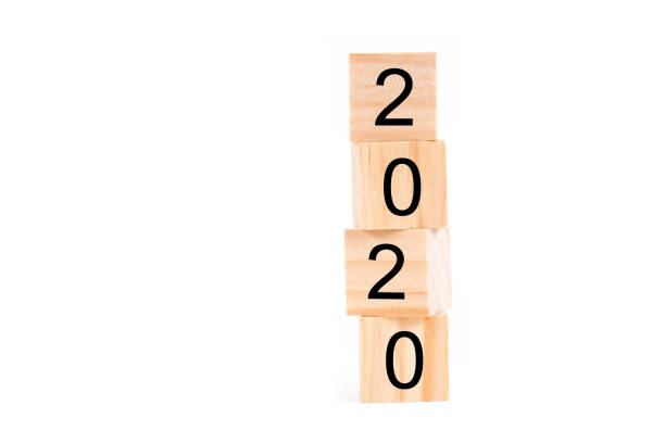 istock Happy new year 2020 text on wooden cubes on white background. Banner with copy space for text. 1163467272