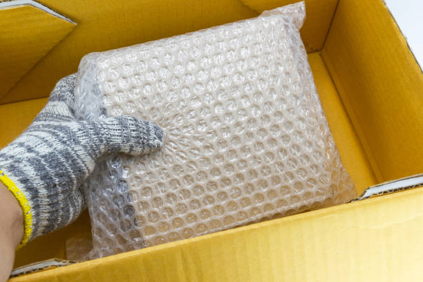 istock hand of man hold bubble pack, for protection parcel product cracked 1163477611