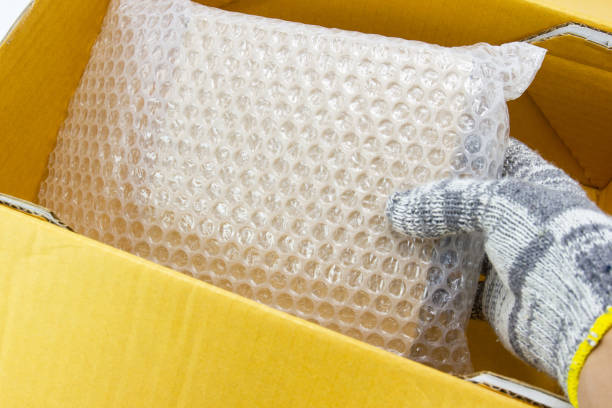 istock hand of man hold bubble pack, for protection parcel product cracked 1163477612