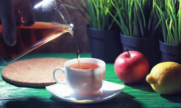 istock Brewing tea on a wooden table 1163478638