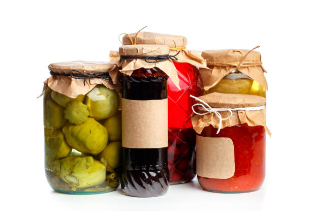 istock glass bottle with preserved food on black background - Image 1163480449