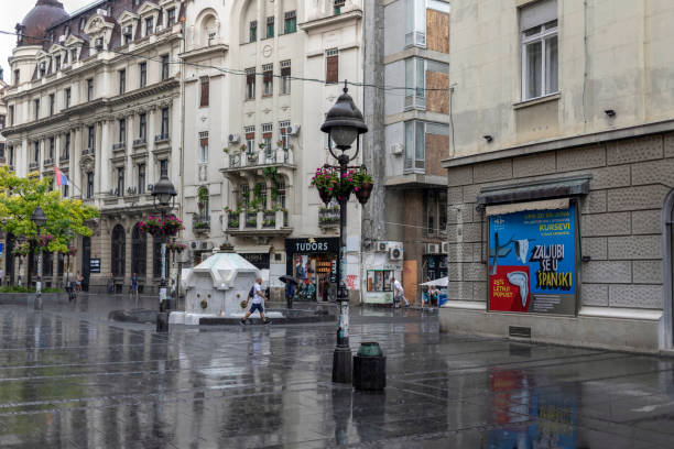 Belgrade, Serbia - Urban scene with people walking down the Knez Mihailova Street during the light rain Belgrade, Serbia, June 18th 2019: Urban scene with people walking down the Knez Mihailova Street during the light rain knez mihailova stock pictures, royalty-free photos & images