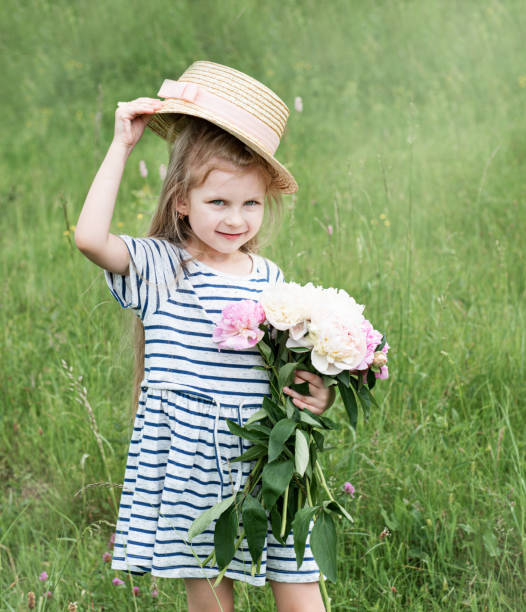 istock Cute little girl in a field 1163483255