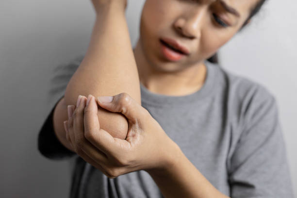 istock Women with pain in elbow. 1163483934