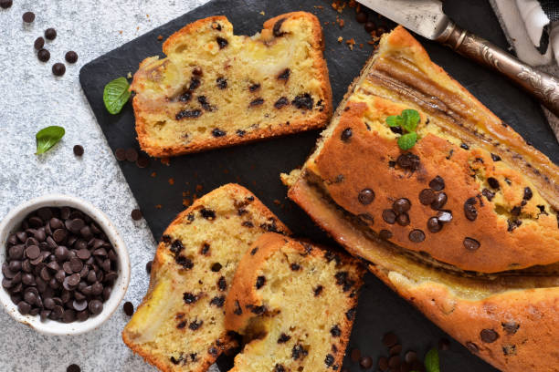 istock Banana cake with chocolate drops on the kitchen table. Classic dessert. 1163484172