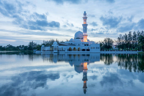istock Reflection Of Lighthouse In Lake Against Sky 1163487559