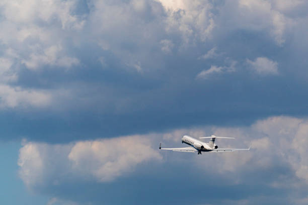 istock airplane after taking off on the clouds 1163488536