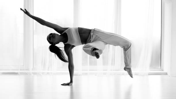 istock Profesional Contemp Dancer Training In Studio. Black and White 1163490044