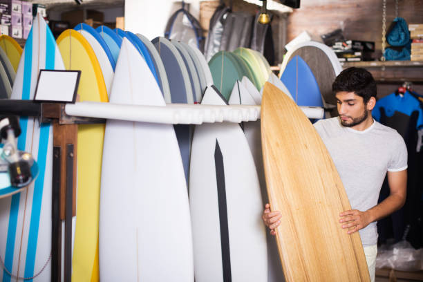 istock male surfer holding professional surfboard 1163491118