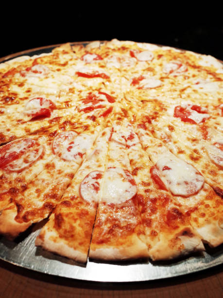 istock Slice of Pizza Topping Cheese and Tomato 1163491608